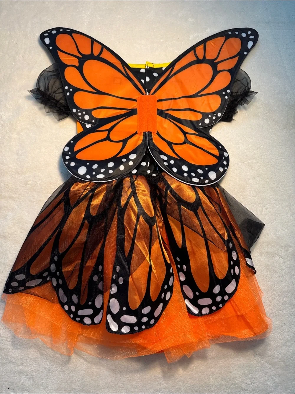 Halloween children’s orange and black monarch butterfly costume. Removable wings
